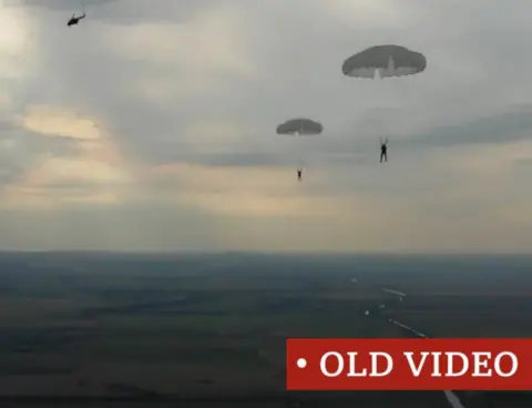 TIKTOK Screen grab of TikTok clip of Russian men parachuting