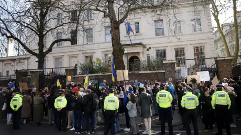 Reuters Protesters outside the Russian embassy in London