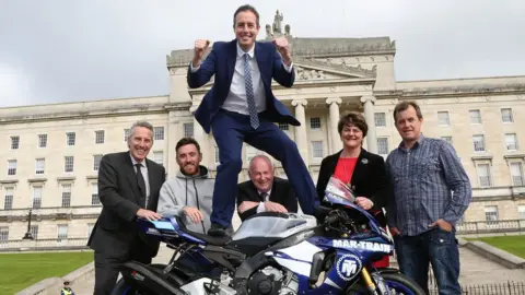 PACEMAKER Paul Givan pictured with top road racers Lee Johnston and John McGuinness