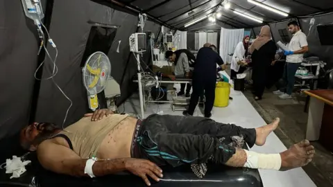 Anadolu Patients are treated at a field hospital in Rafah, in the southern Gaza Strip (8 May 2024)