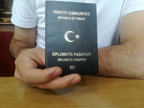 Military officer holding diplomatic passport