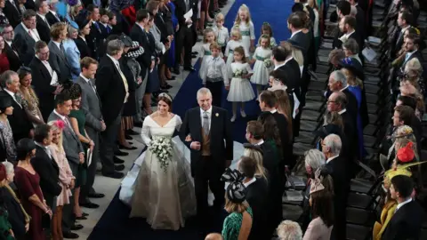 PA Princess Eugenie walks down the aisle with her father, the Duke of York, for her wedding to Jack Brooksbank at St George"s Chapel in Windsor Castle