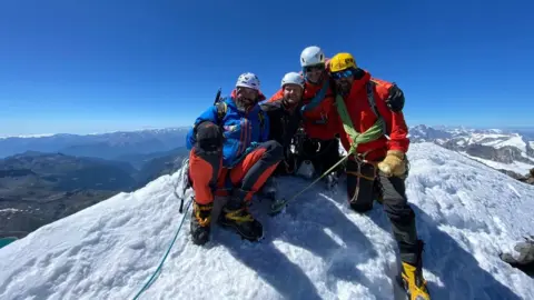 Mark Hooks Neil Heritage (second left) at the summit of the Matterhorn