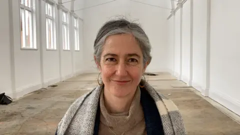 David Webster/BBC Ros Hathorn inside the Mill Road building