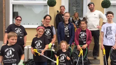 Children and adults from the 'Clean our streets' group