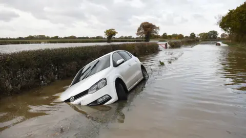 Getty Images Car on flooded road near Fishlake