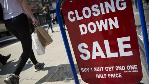 Jack Taylor/Getty Images Closing down sale sign