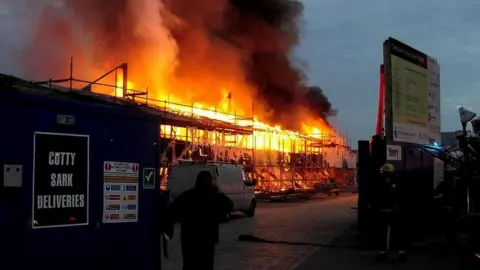 PA Media Cutty Sark on fire