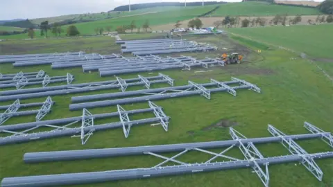 SSE/BALFOUR BEATTY Helicopter and electricity towers