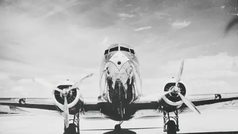 American Airlines DC-3 passenger airplane waits for takeoff on the runway.