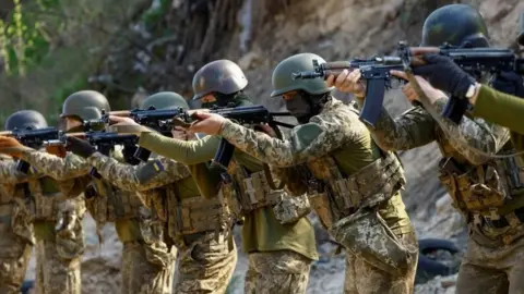 Reuters Members of Ukraine's Siberian battalion on exercises outside Kyiv