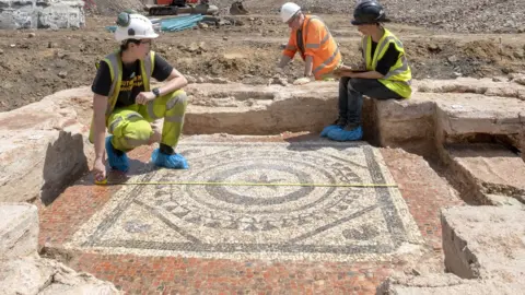 MOLA Archaeologists on the mosaic