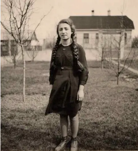 Gabriele Keenaghan Gabriele Keenaghan standing in a garden with a house behind in Vienna in 1938