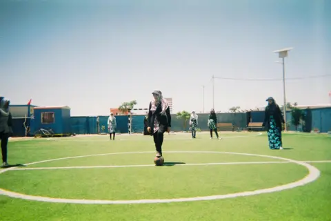 Maram A group of girls play football