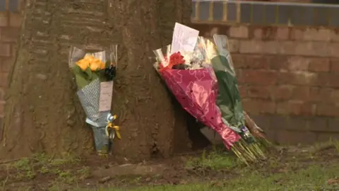 Floral tributes have been left at the scene