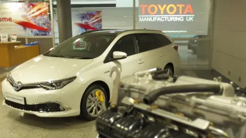 Toyota car in showroom/reception with engine block