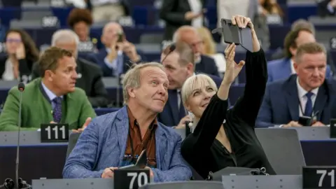 European Parliament MEPs take a selfie in the Strasbourg chamber