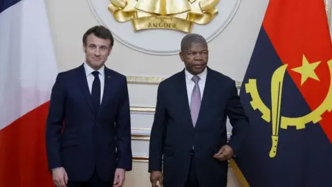 AFP French president Emmanuel Macron (L) meets with Angola's president Joao Lourenço