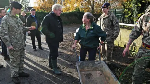 Getty Images Boris Johnson visiting Stainforth, South Yorkshire, during flooding in November 2019