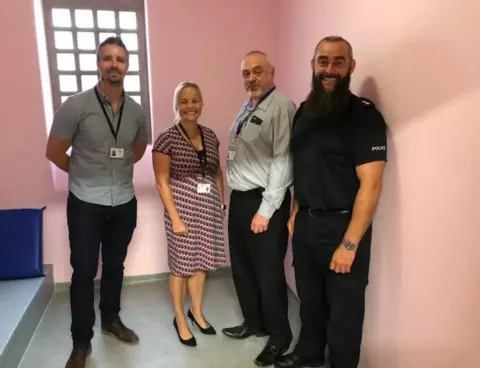 Thames Valley Police Pink jail cell with (l-r) Sgt Dave Williams, Supt Katy Barrow-Grint, former Ch Insp Dave Cherrington, Insp Dave Entwistle