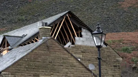 Richard McCarthy/PA House roofing blown off in Stalybridge