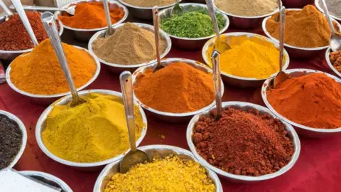 Getty Images Spices on sale at a market in India