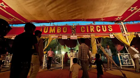 Getty Images Indian spectators arrive to watch the Jumbo Circus in Gurgaon, some 35 kms from New Delhi, on April 20, 2012.