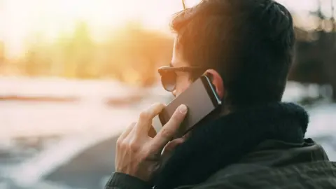 Getty Images man on the phone