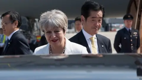 PA Theresa May on the first day of a trip to Japan