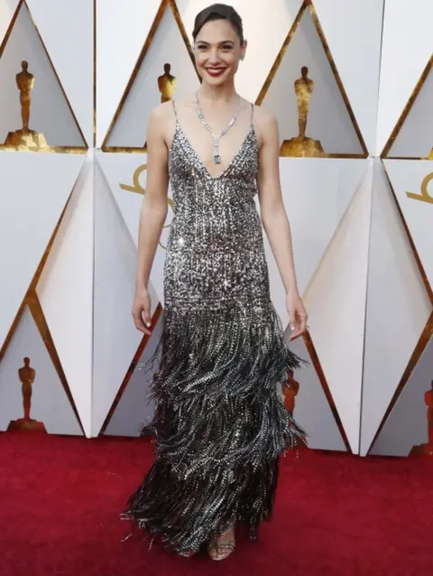 Reuters Wonder Woman actress Gal Gadot wears a strappy silver Givenchy couture dress on the Oscars red carpet