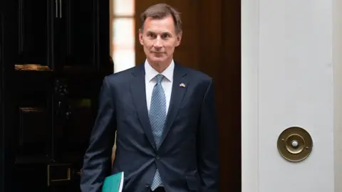 PA Media Jeremy Hunt leaving 11 Downing Street.