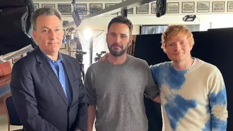 The BBC's Mark Urban, McDaid, and Sheeran