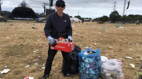 Jason from Manchester doing his bit of litter picking before heading off home