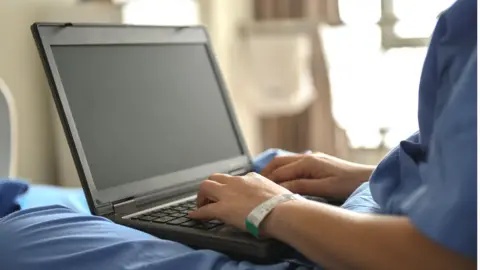 Getty Images Patient on laptop
