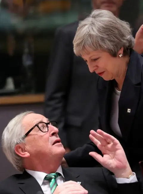 Reuters Theresa May speaking to Jean-Claude Juncker at the EU summit in December