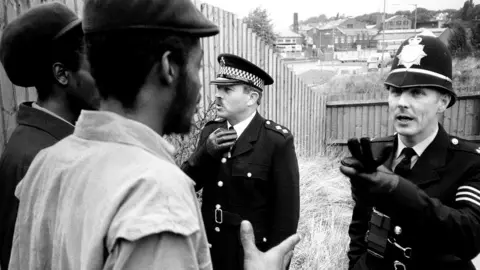 Pogus Caesar/OOM Gallery Archive/DACS/Artimage 202 Picture of two men and two police men