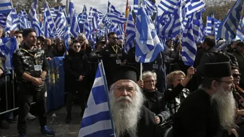 EPA Hundreds of people wave flags