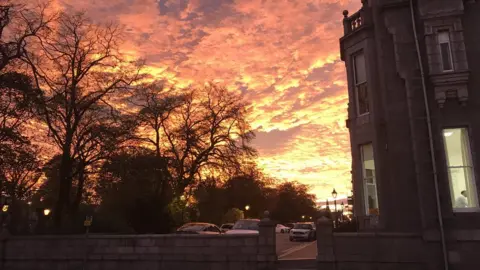Spectacular pink and orange sunset lights up sky - BBC News