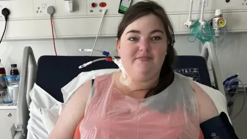 Family handout Hayley Martin in a hospital bed