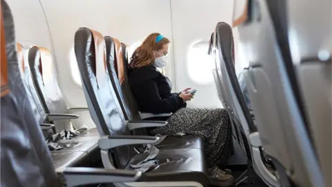 Getty Images Person on a plane