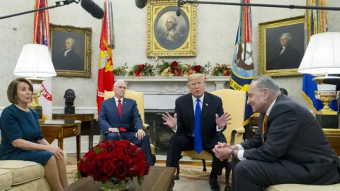 EPA Trump in his office with Pence, Pelosi and Schumer on 11 December 2018