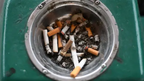 Getty Images ashtray with cigarette butts