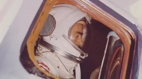 Getty Images Astronaut Walter Cunningham seen through the window of the Spacecraft 012 Command Module during an altitude chamber test in the Manned Spacecraft Operations Building, Merritt Island, Kennedy Space Center, Florida, 30th December 1966.