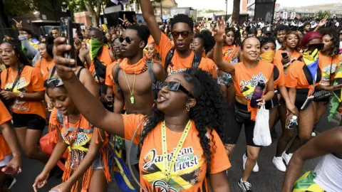 EPA/ANDY RAIN Notting Hill Carnival goers