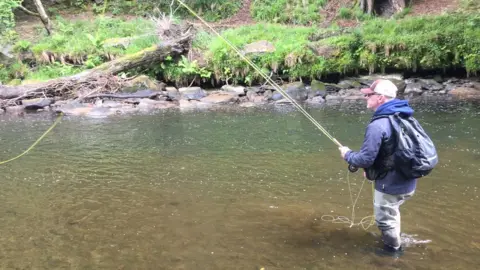 Seán McLaughlin fishing in the Faughan River