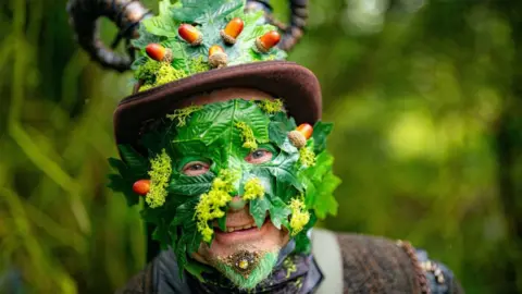 PA Media A man with a green mask