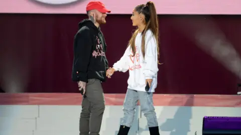 Getty Images Mac Miller and Ariana Grande on stage at One Love Manchester