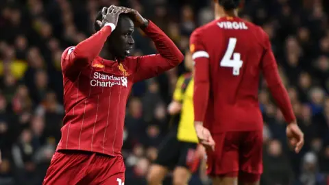 Liverpool's players react during the FA Cup defeat at Chelsea