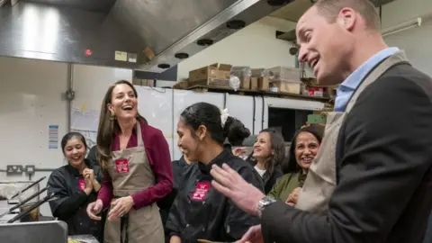 PA Media Princess and Prince of Wales in the kitchen of the Indian Streatery