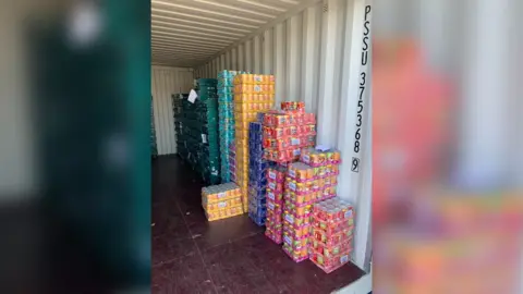 The BAY Piles of stacked up tins